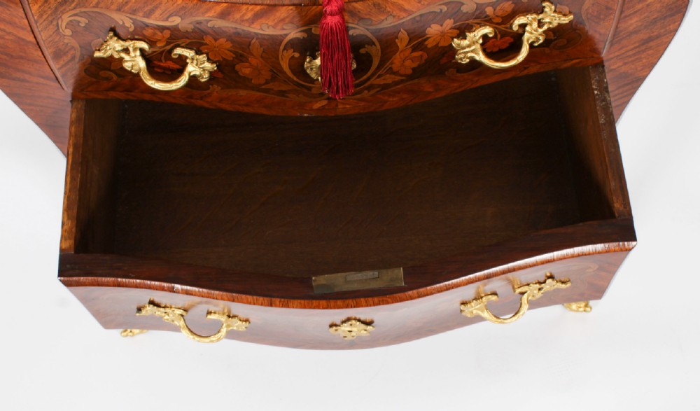 A 19th-century French Louis XV Revival commode with floral marquetry inlay, a variegated marble top, three drawers, and gilt-bronze mounts. View XIII
