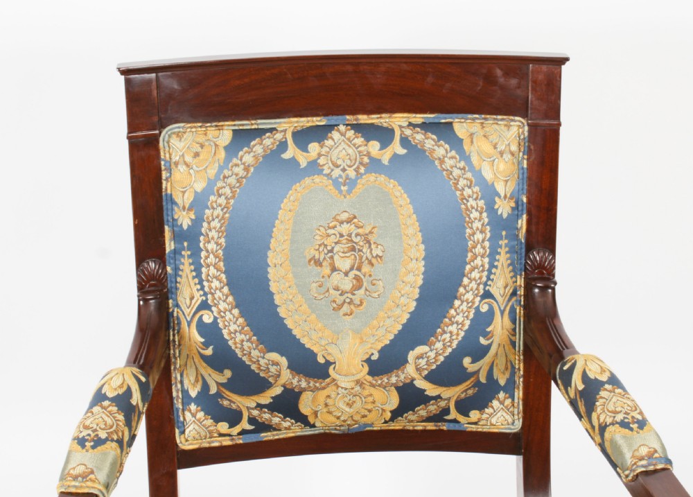 A pair of 19th-century French Empire Revival mahogany armchairs upholstered in blue and gold patterned silk damask featuring gilt ormolu mounts. View III