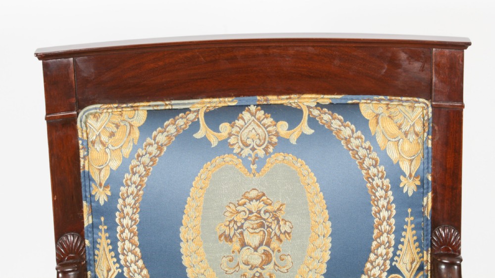 A pair of 19th-century French Empire Revival mahogany armchairs upholstered in blue and gold patterned silk damask featuring gilt ormolu mounts. View IV