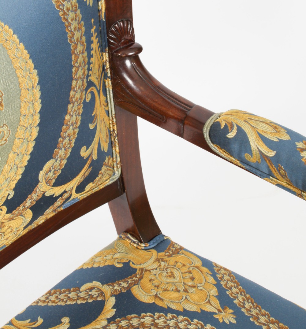 A pair of 19th-century French Empire Revival mahogany armchairs upholstered in blue and gold patterned silk damask featuring gilt ormolu mounts. View XIII