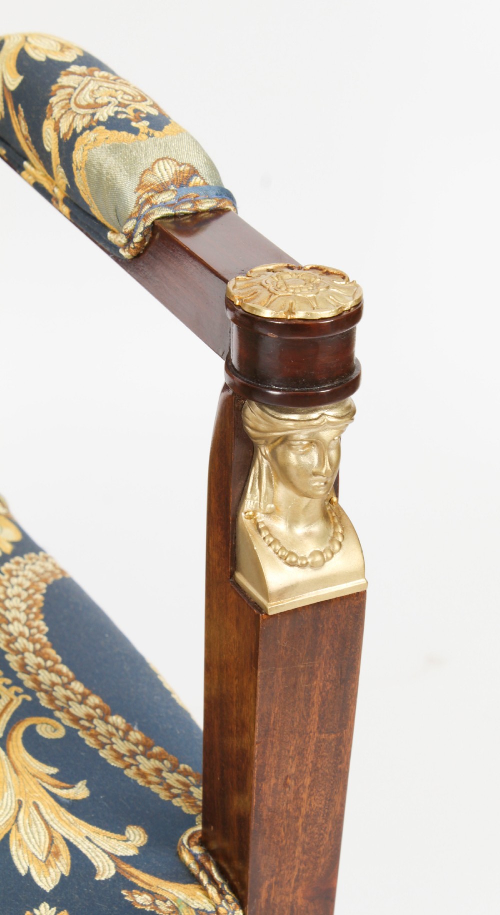 A pair of 19th-century French Empire Revival mahogany armchairs upholstered in blue and gold patterned silk damask featuring gilt ormolu mounts. View XVI