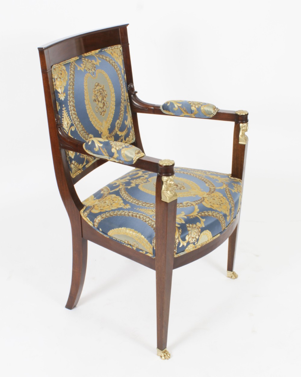 A pair of 19th-century French Empire Revival mahogany armchairs upholstered in blue and gold patterned silk damask featuring gilt ormolu mounts. View XXIII