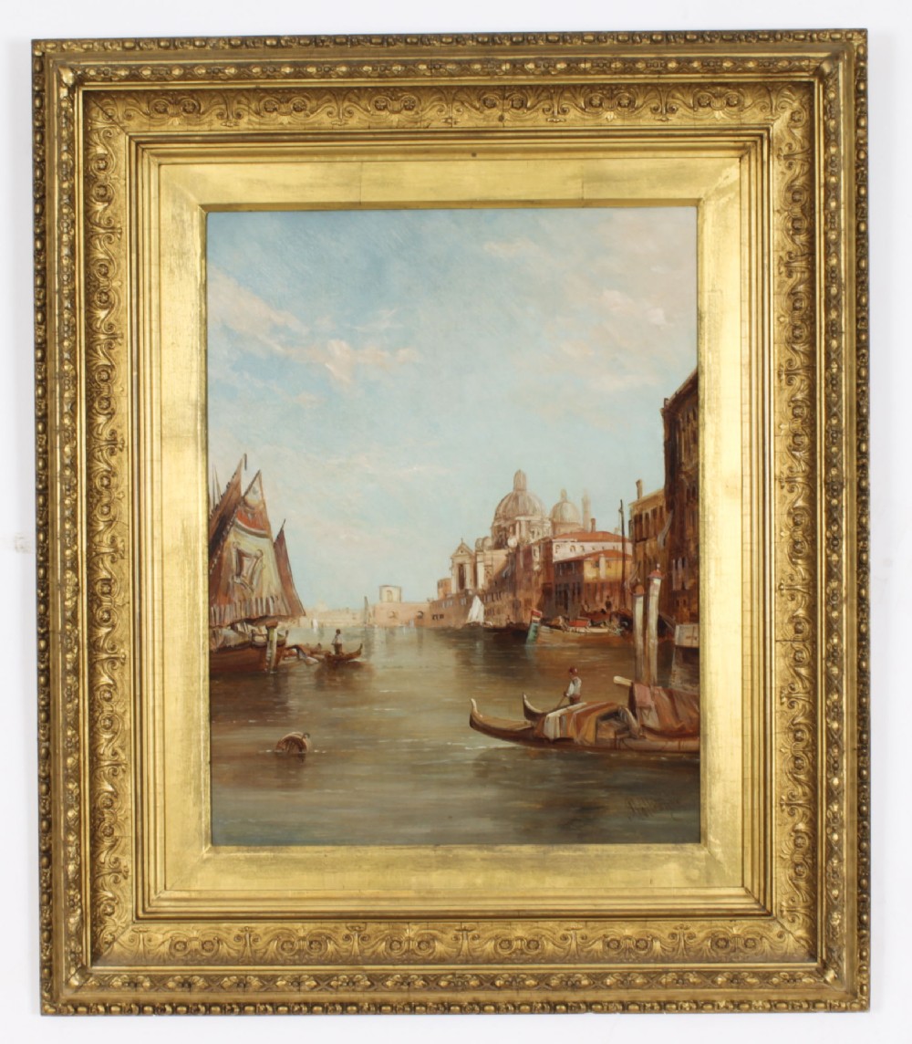 An antique 19th-century oil painting depicting gondolas on the Grand Canal with Santa Maria della Salute in Venice, housed within a heavily carved gold gilded frame.
