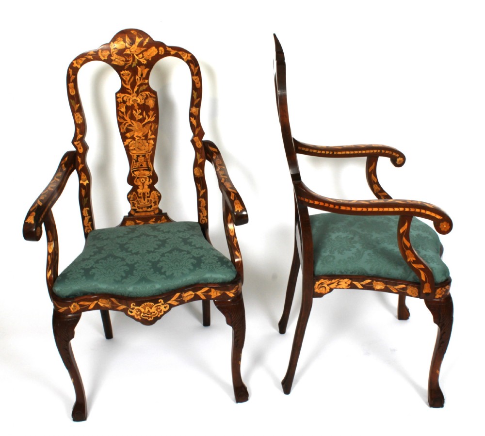 A pair of late eighteenth-century Dutch walnut high back armchairs featuring detailed floral marquetry inlay throughout and green damask drop-in seats. View III