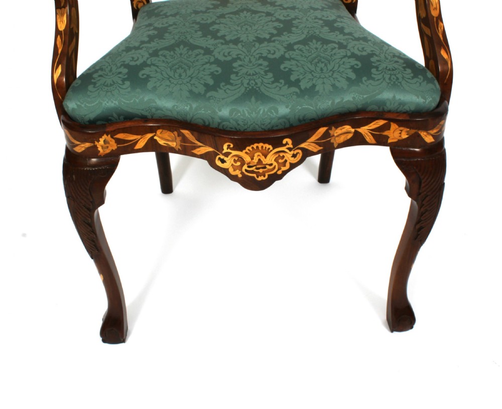 A pair of late eighteenth-century Dutch walnut high back armchairs featuring detailed floral marquetry inlay throughout and green damask drop-in seats. View IV