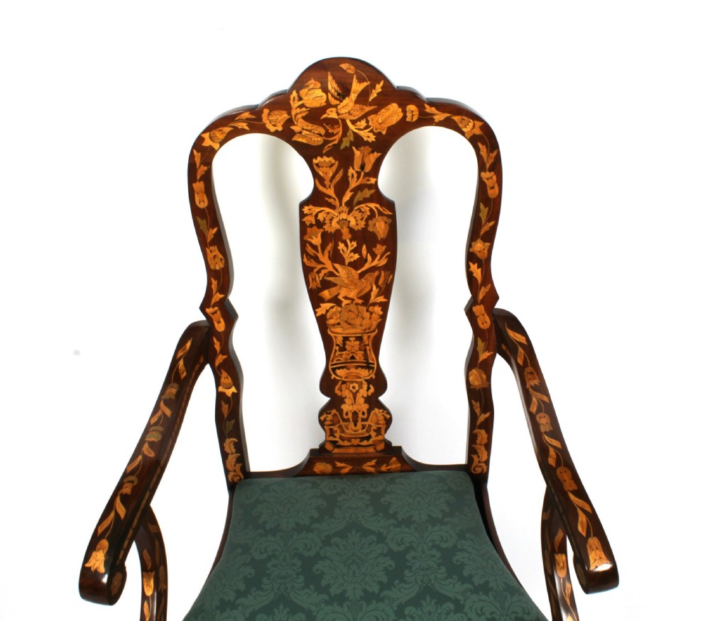 A pair of late eighteenth-century Dutch walnut high back armchairs featuring detailed floral marquetry inlay throughout and green damask drop-in seats. View VII