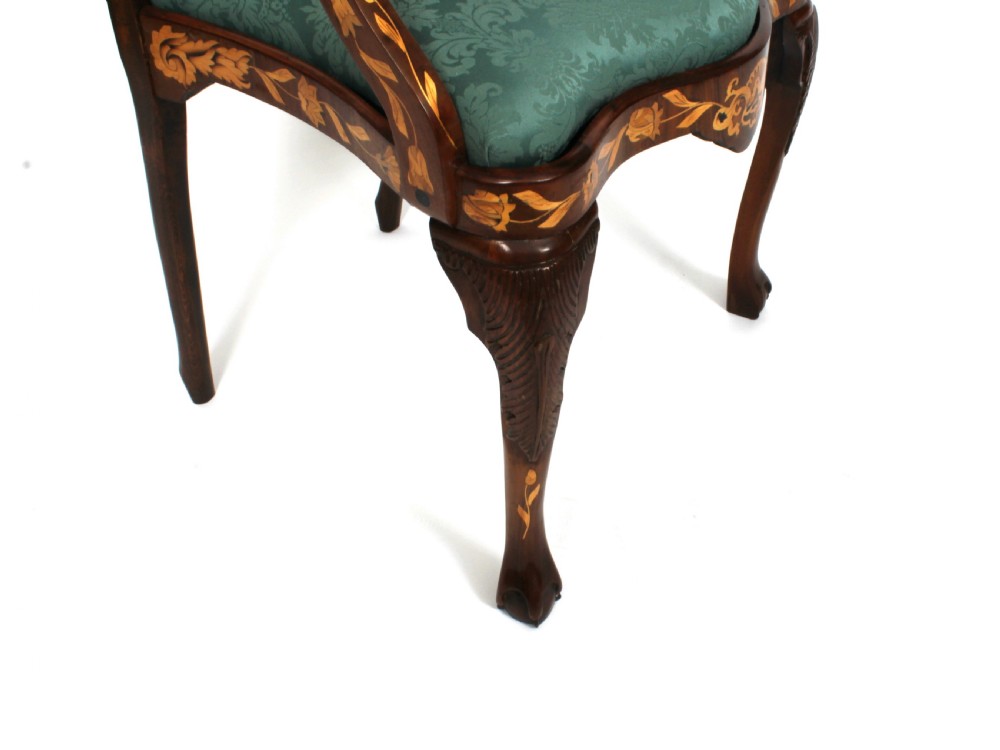 A pair of late eighteenth-century Dutch walnut high back armchairs featuring detailed floral marquetry inlay throughout and green damask drop-in seats. View IX