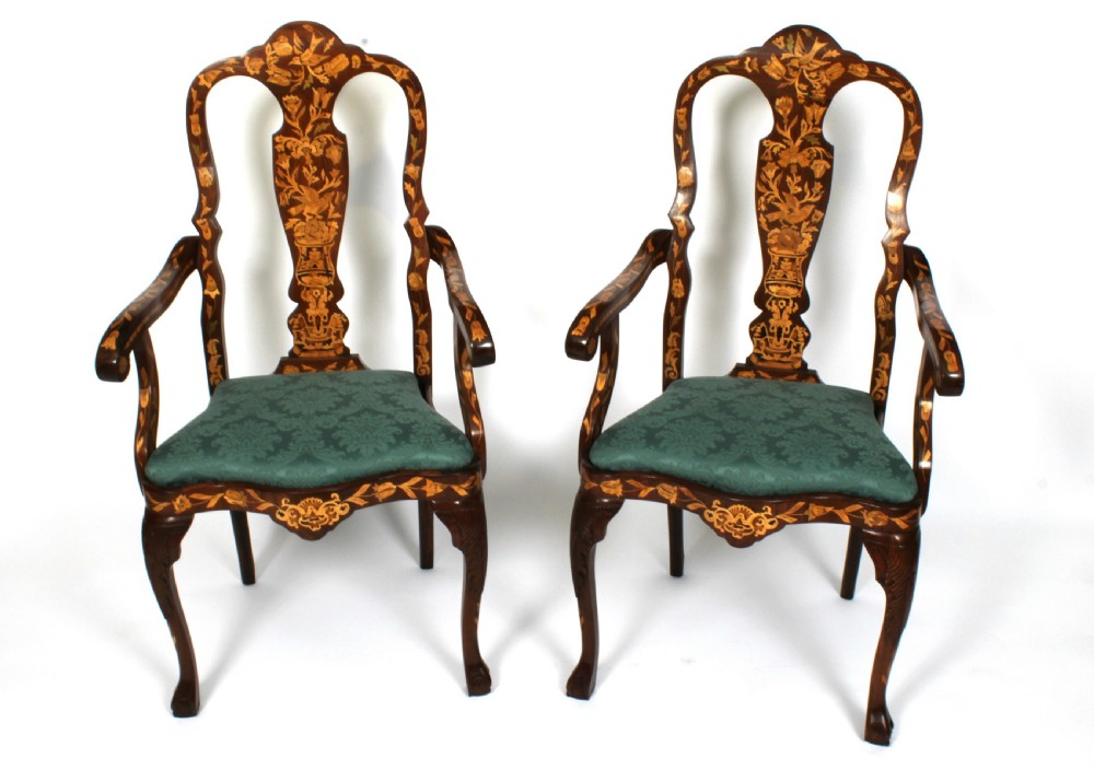 A pair of late eighteenth-century Dutch walnut high back armchairs featuring detailed floral marquetry inlay throughout and green damask drop-in seats. View XII