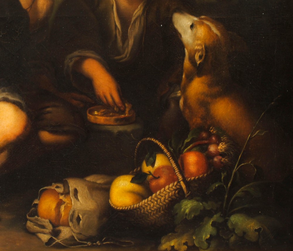 An 18th-century oil painting depicting two boys with a dog and fruit, housed within a gilded frame with a scrolled top crest. View V