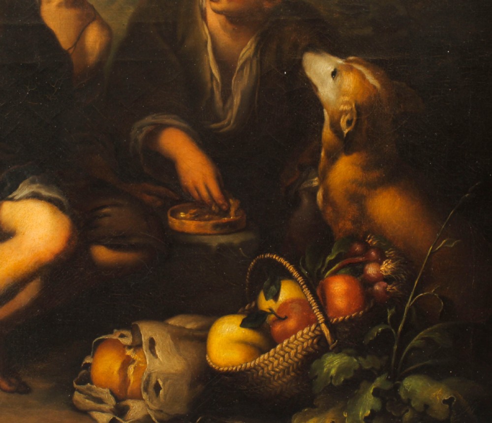 An 18th-century oil painting depicting two boys with a dog and fruit, housed within a gilded frame with a scrolled top crest. View VI