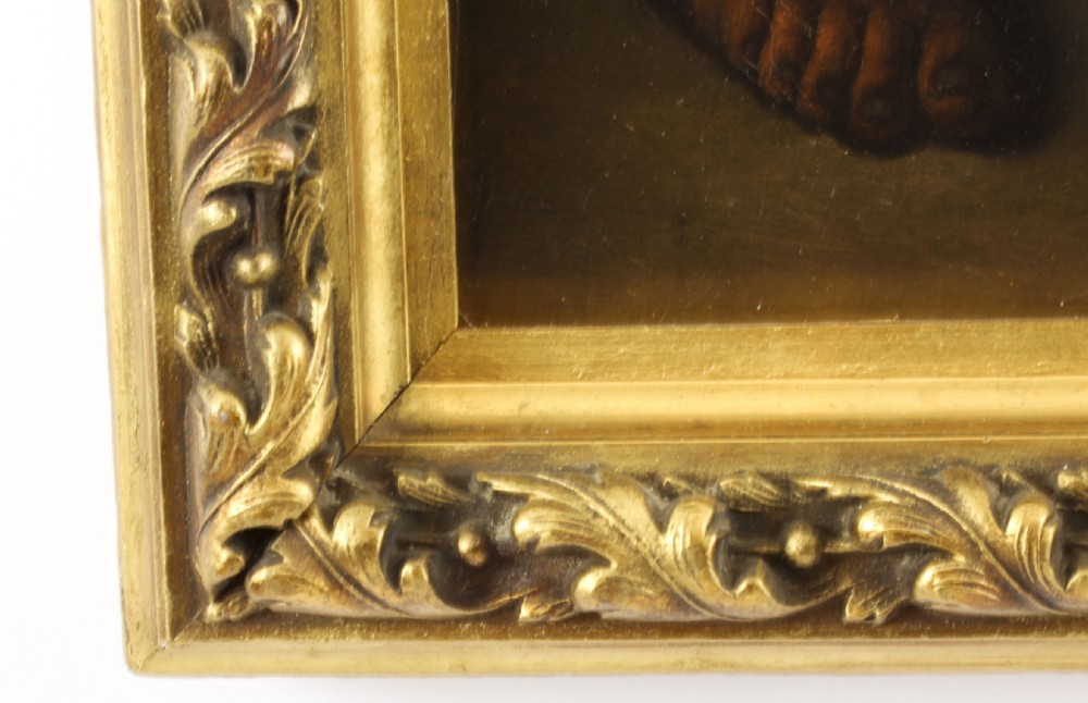 An 18th-century oil painting depicting two boys with a dog and fruit, housed within a gilded frame with a scrolled top crest. View X
