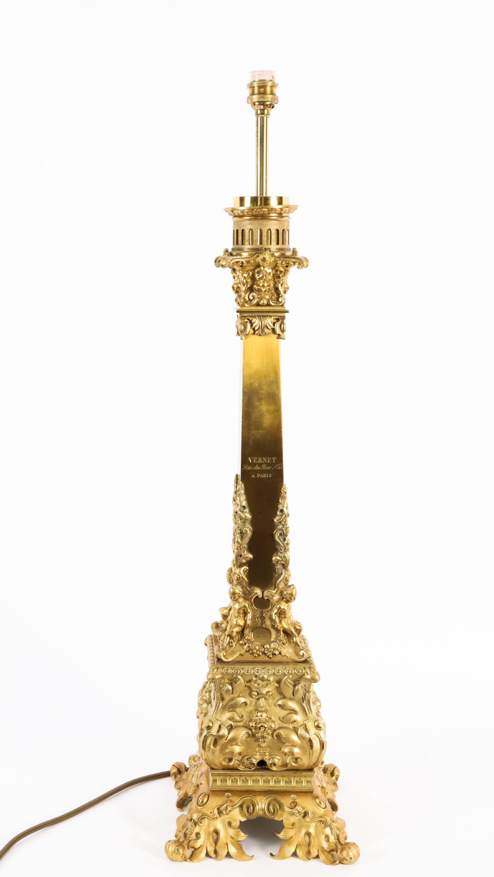 A pair of 19th-century French ormolu table lamps featuring cast gilt bronze bases and cream flared fabric shades with tassel fringe trim. View VIII