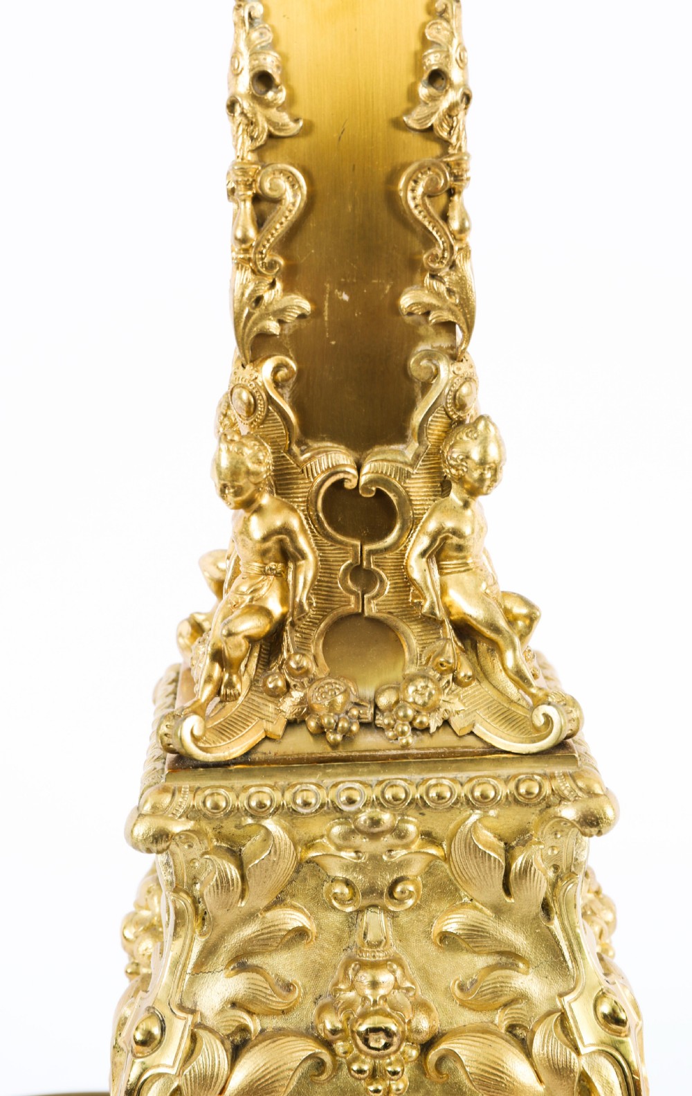 A pair of 19th-century French ormolu table lamps featuring cast gilt bronze bases and cream flared fabric shades with tassel fringe trim. View X
