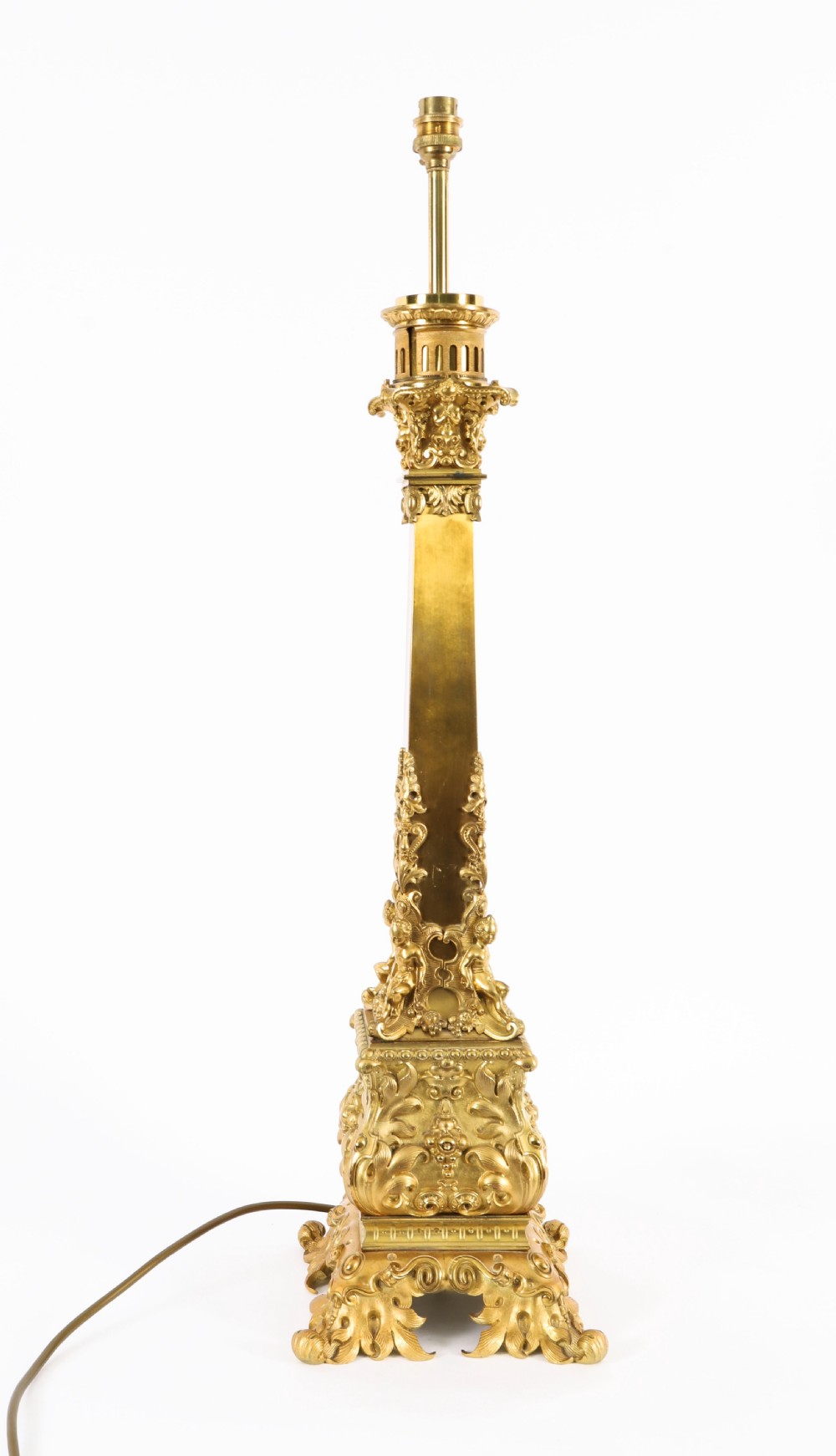 A pair of 19th-century French ormolu table lamps featuring cast gilt bronze bases and cream flared fabric shades with tassel fringe trim. View XI