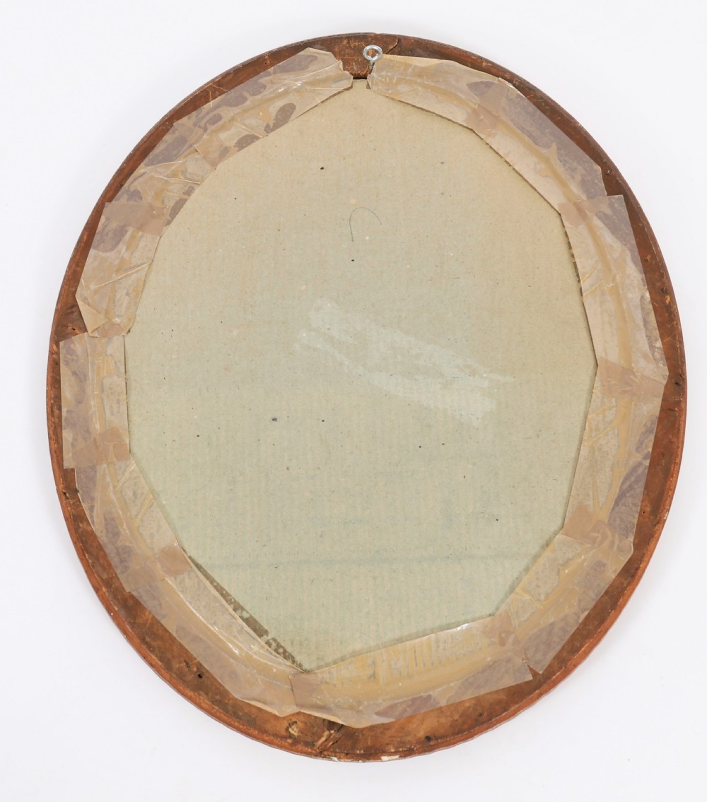 A matching pair of 19th-century French oval wall mirrors featuring carved giltwood frames with a beaded pattern and gold leaf finish. View XIII