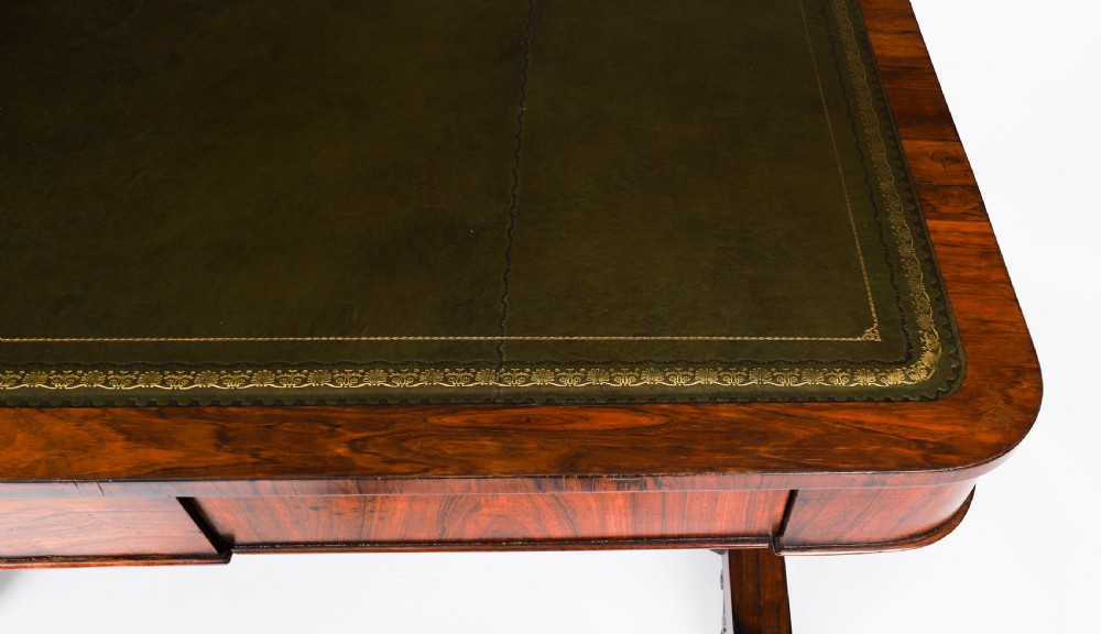 A nineteenth-century William IV writing table crafted from Goncalo Alves wood featuring a green leather top and carved paw feet. View XI