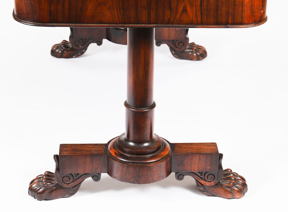 A nineteenth-century William IV writing table crafted from Goncalo Alves wood featuring a green leather top and carved paw feet. View XIII
