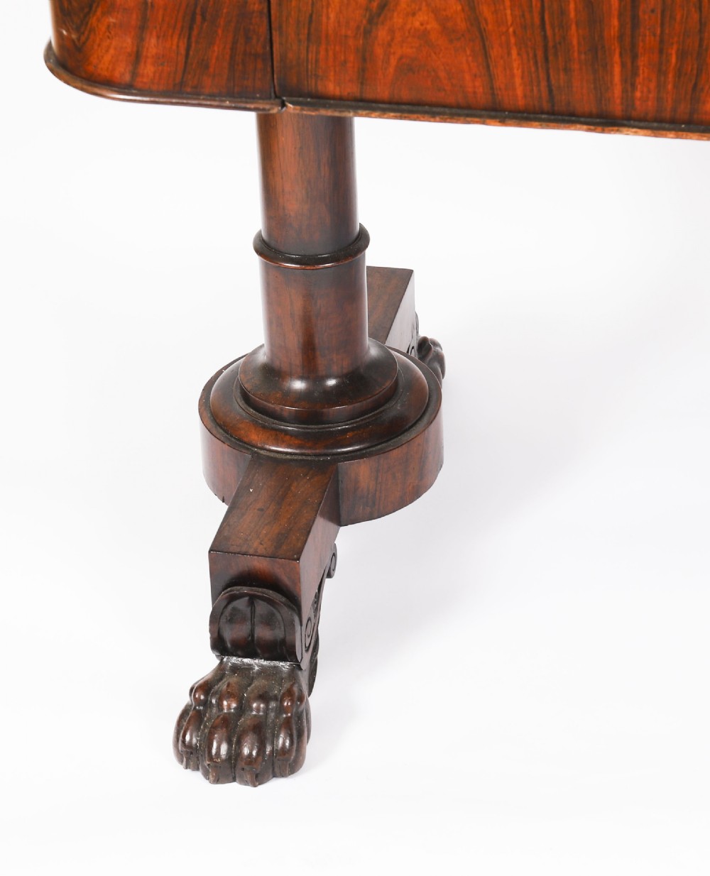 A nineteenth-century William IV writing table crafted from Goncalo Alves wood featuring a green leather top and carved paw feet. View XV
