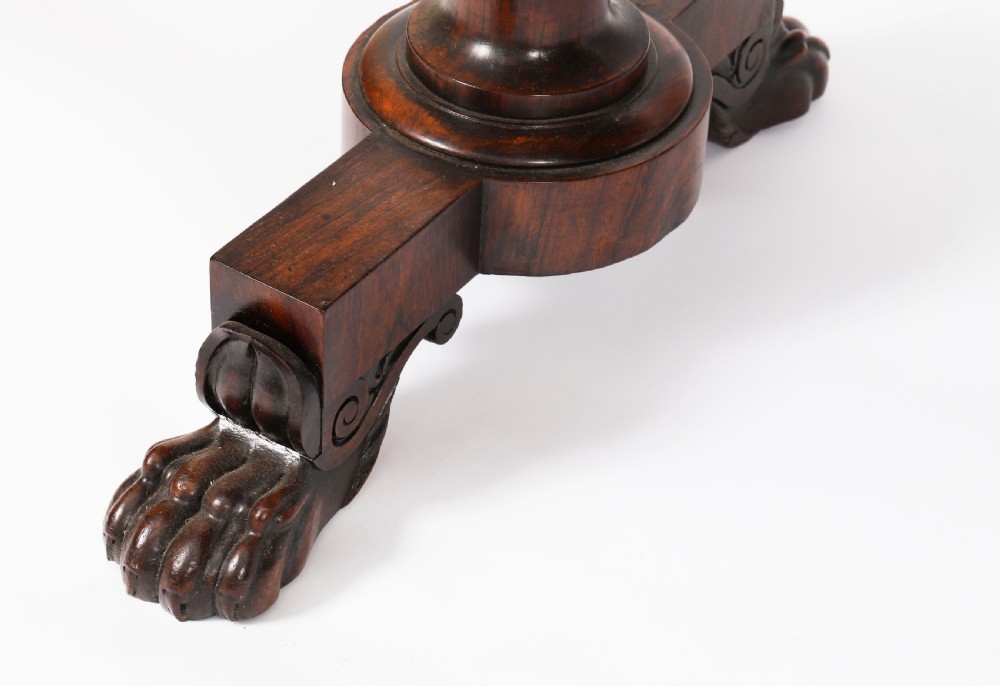 A nineteenth-century William IV writing table crafted from Goncalo Alves wood featuring a green leather top and carved paw feet. View XVII