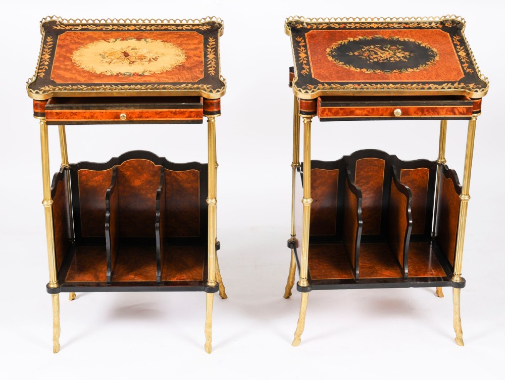 A pair of 19th-century French occasional side tables featuring marquetry tops with brass gallery rails, lower partitioned racks, and gilt metal legs. View V