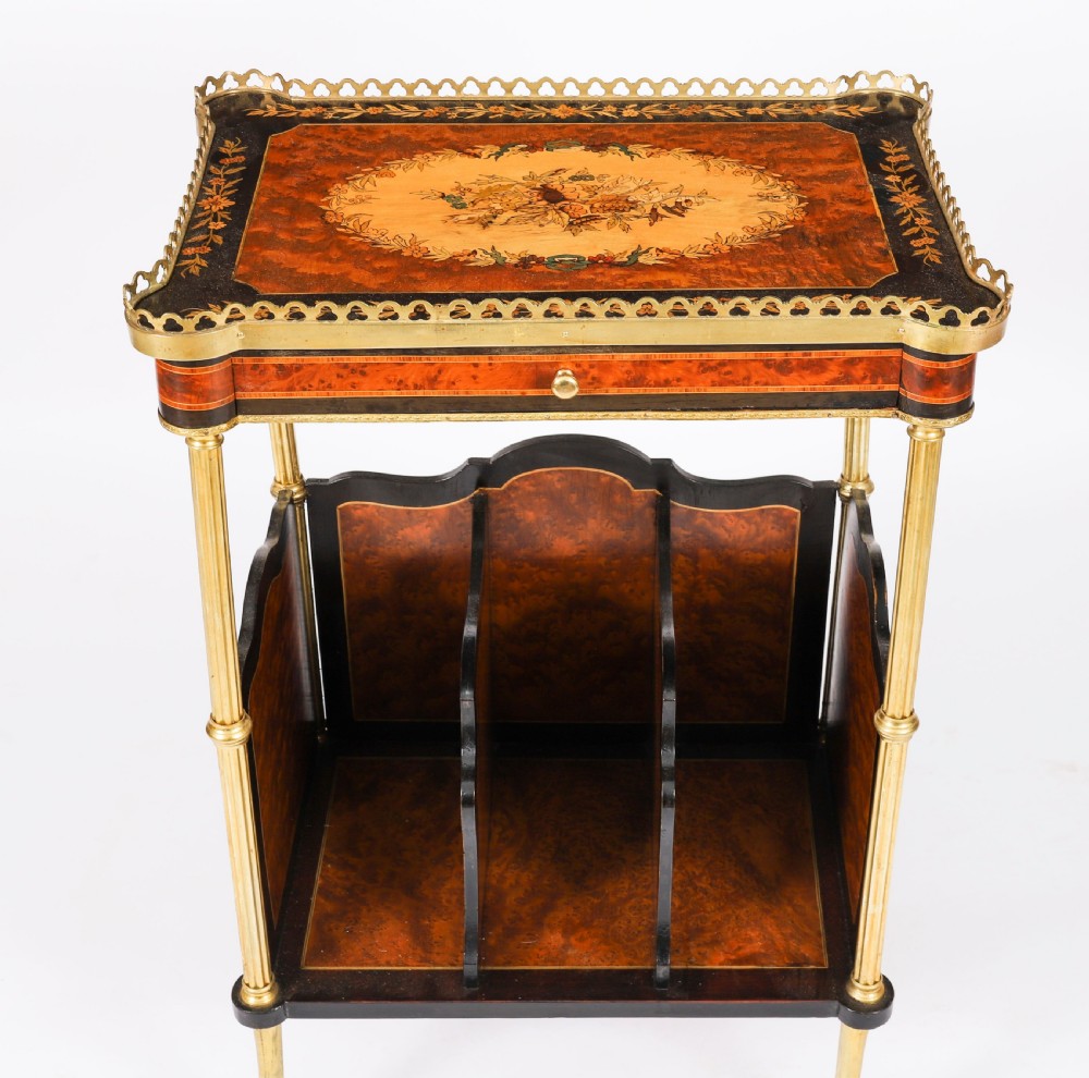 A pair of 19th-century French occasional side tables featuring marquetry tops with brass gallery rails, lower partitioned racks, and gilt metal legs. View XII
