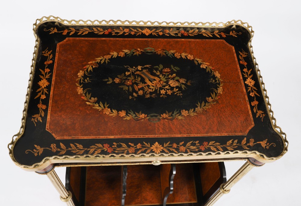 A pair of 19th-century French occasional side tables featuring marquetry tops with brass gallery rails, lower partitioned racks, and gilt metal legs. View XV