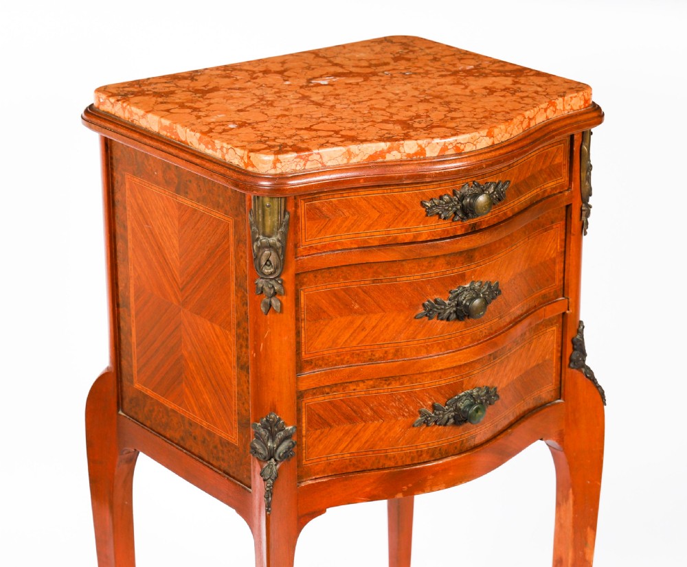 A pair of 19th-century French Louis XV style parquetry bedside cabinets featuring marble tops, three drawers, and cabriole legs with bronze mounts. View XII