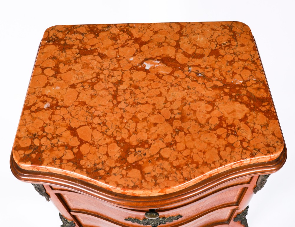 A pair of 19th-century French Louis XV style parquetry bedside cabinets featuring marble tops, three drawers, and cabriole legs with bronze mounts. View XV