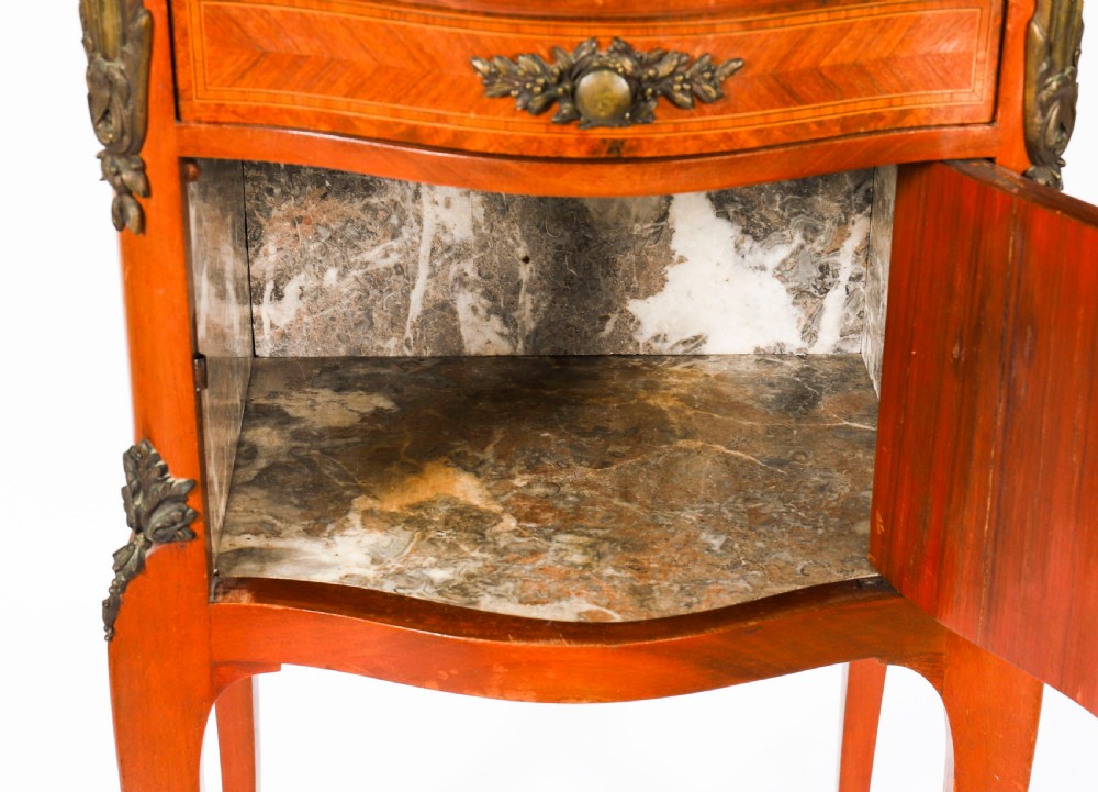 A pair of 19th-century French Louis XV style parquetry bedside cabinets featuring marble tops, three drawers, and cabriole legs with bronze mounts. View XVII