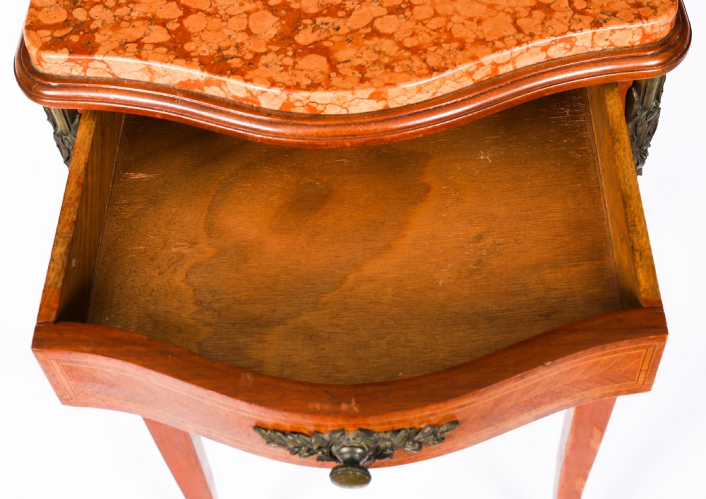 A pair of 19th-century French Louis XV style parquetry bedside cabinets featuring marble tops, three drawers, and cabriole legs with bronze mounts. View XVIII