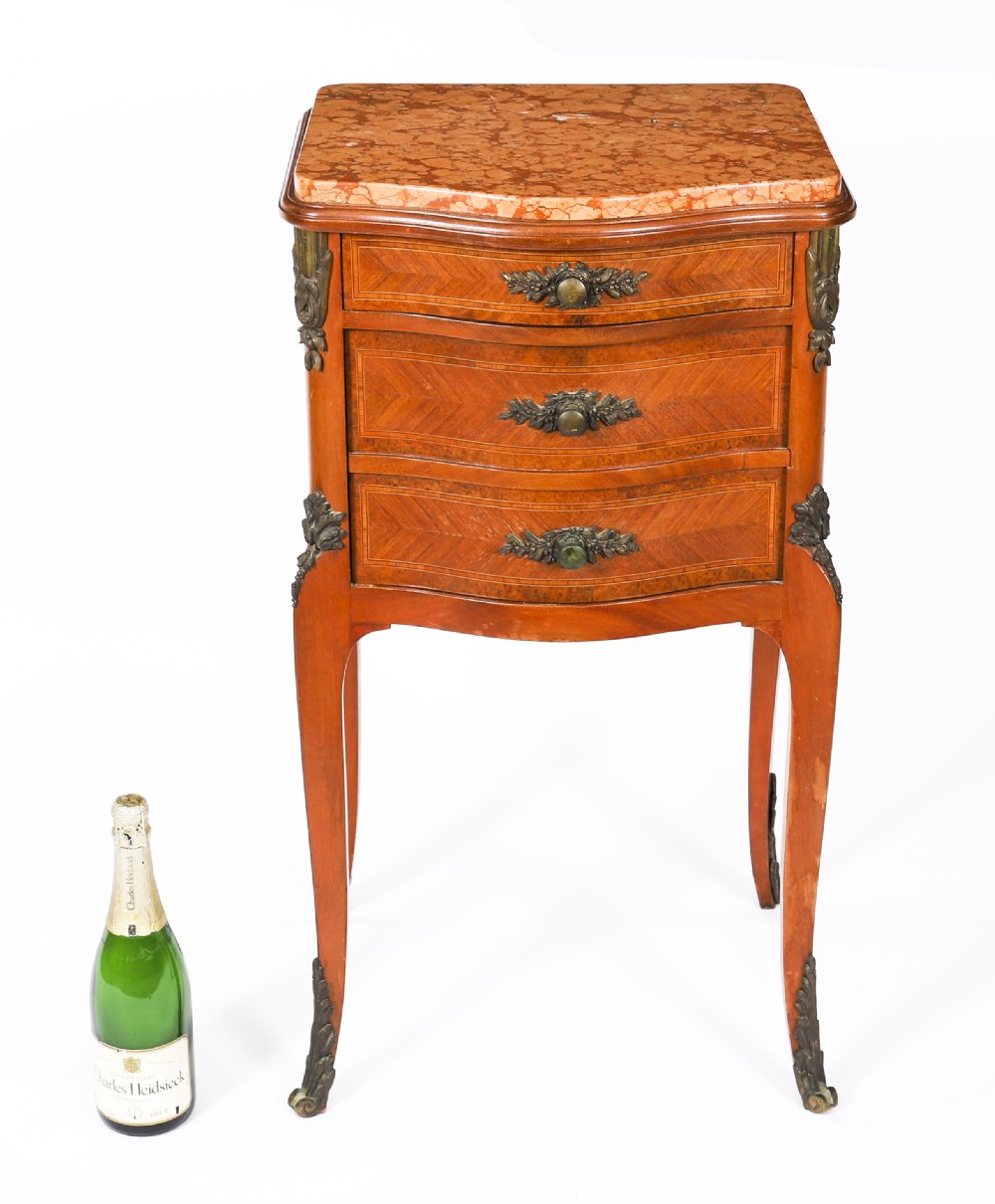 A pair of 19th-century French Louis XV style parquetry bedside cabinets featuring marble tops, three drawers, and cabriole legs with bronze mounts. View XIX