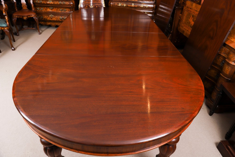 An extended 15ft George III Cuban flame mahogany dining table with turned reeded legs and brass castors. View XIII