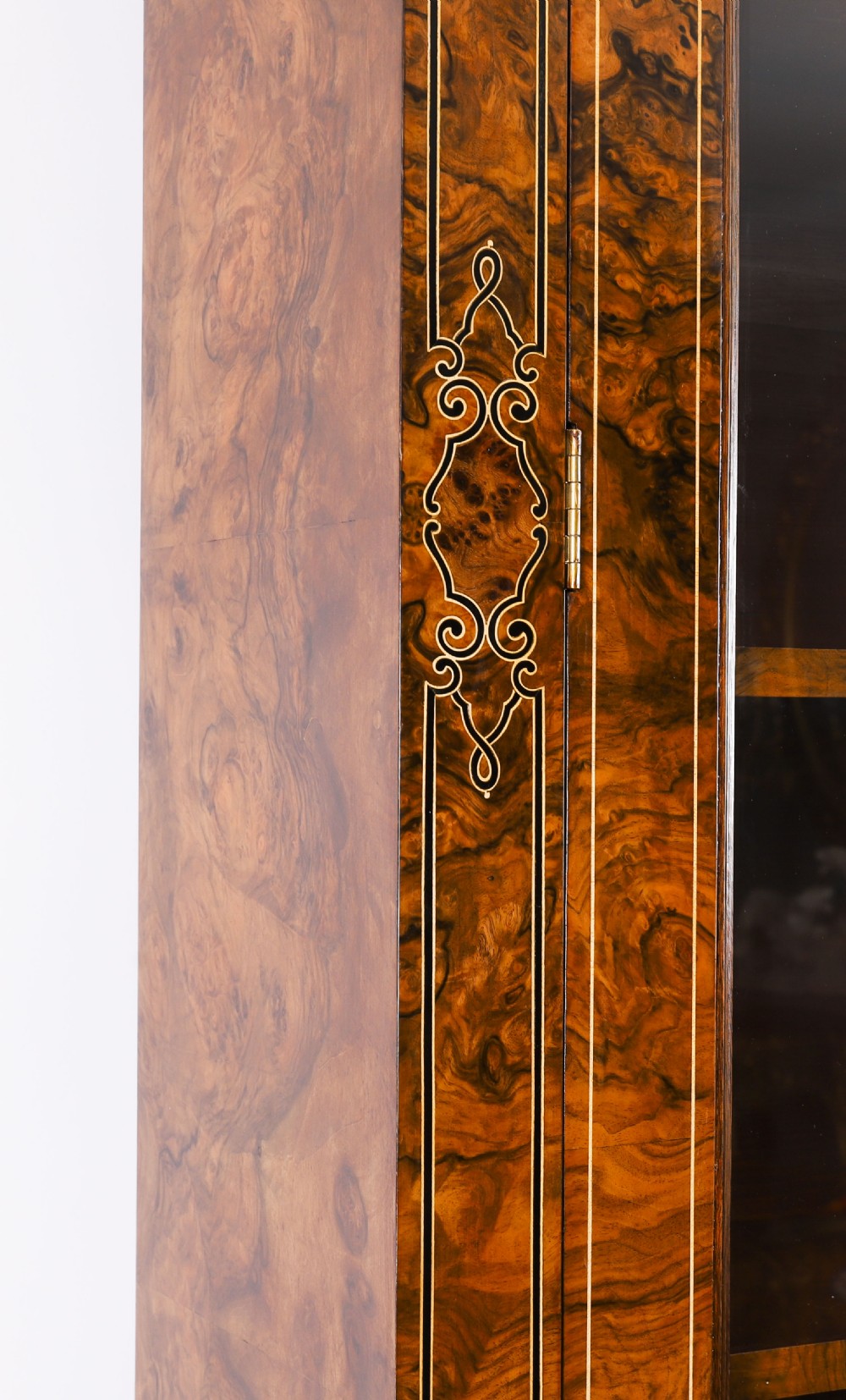 A 19th-century Victorian burr walnut bookcase featuring upper glazed doors, intricate inlay detailing, two drawers, and lower cupboard doors. View VIII
