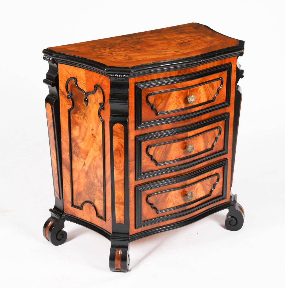 A pair of 18th-century Italian burr walnut serpentine bedside chests featuring ebonised mouldings, three drawers, and scroll feet. View III