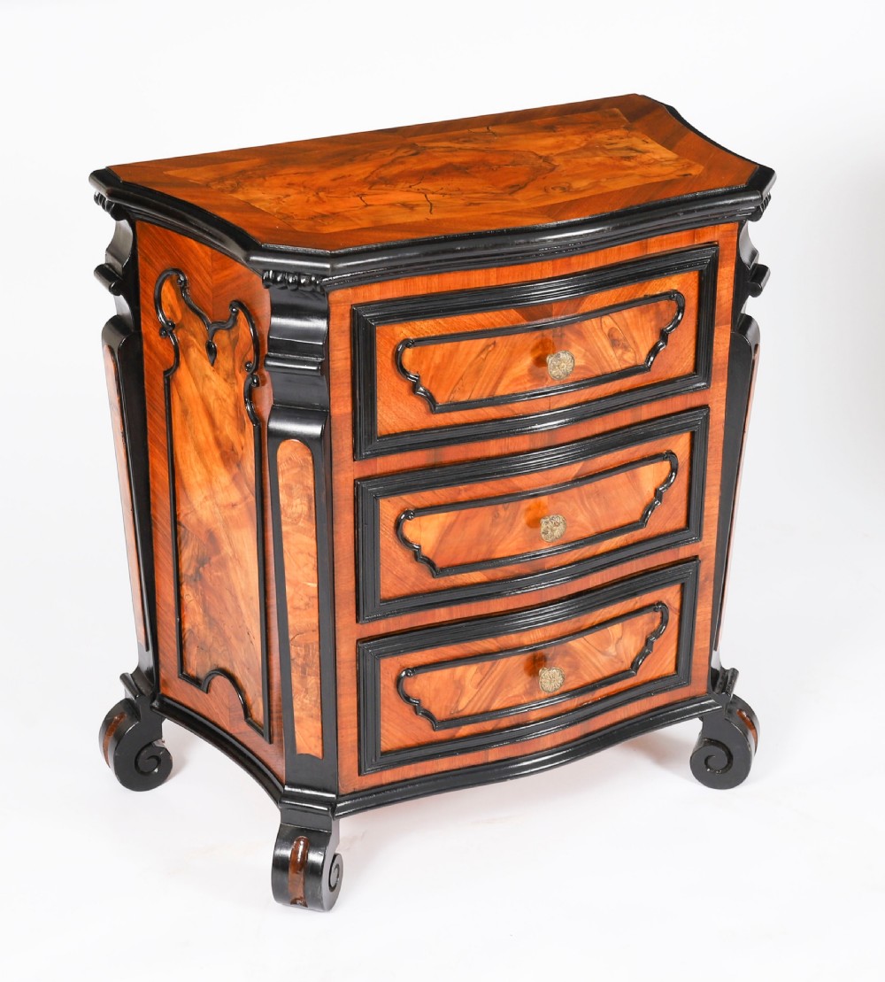 A pair of 18th-century Italian burr walnut serpentine bedside chests featuring ebonised mouldings, three drawers, and scroll feet. View XI