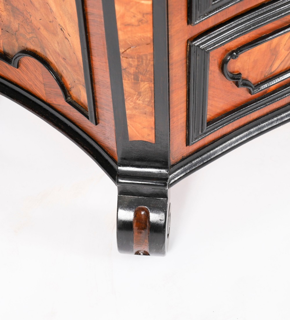 A pair of 18th-century Italian burr walnut serpentine bedside chests featuring ebonised mouldings, three drawers, and scroll feet. View XVIII