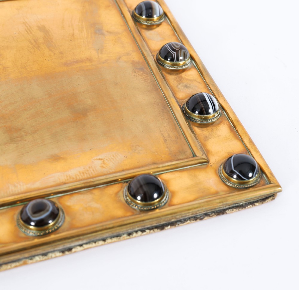 An antique mid-19th century English brass desk set featuring a domed casket and matching tray, both set with polished agate cabochons. View IX