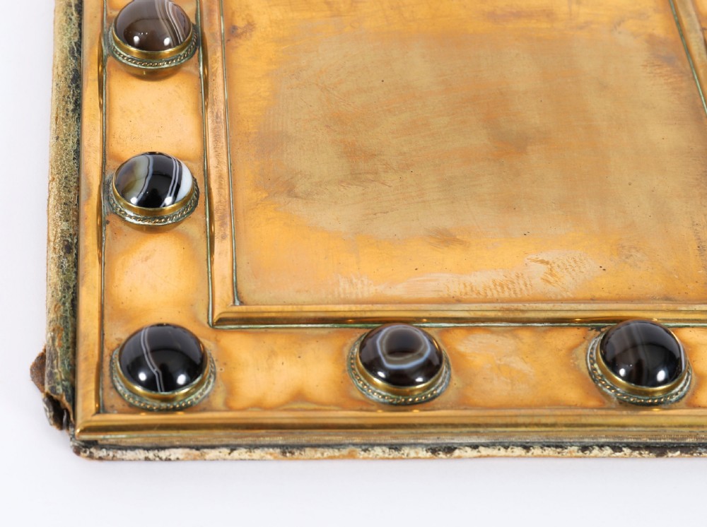 An antique mid-19th century English brass desk set featuring a domed casket and matching tray, both set with polished agate cabochons. View X