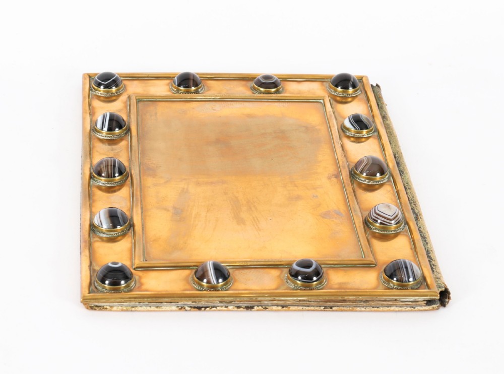 An antique mid-19th century English brass desk set featuring a domed casket and matching tray, both set with polished agate cabochons. View XI