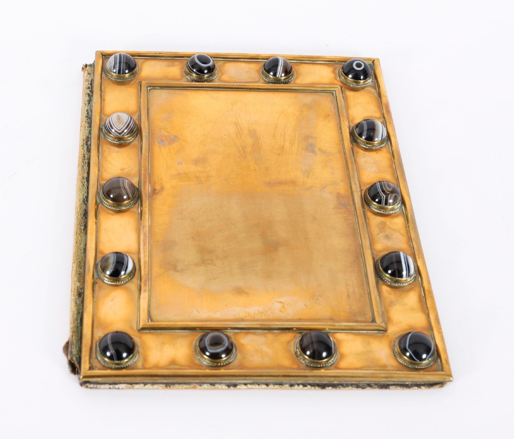 An antique mid-19th century English brass desk set featuring a domed casket and matching tray, both set with polished agate cabochons. View XIV