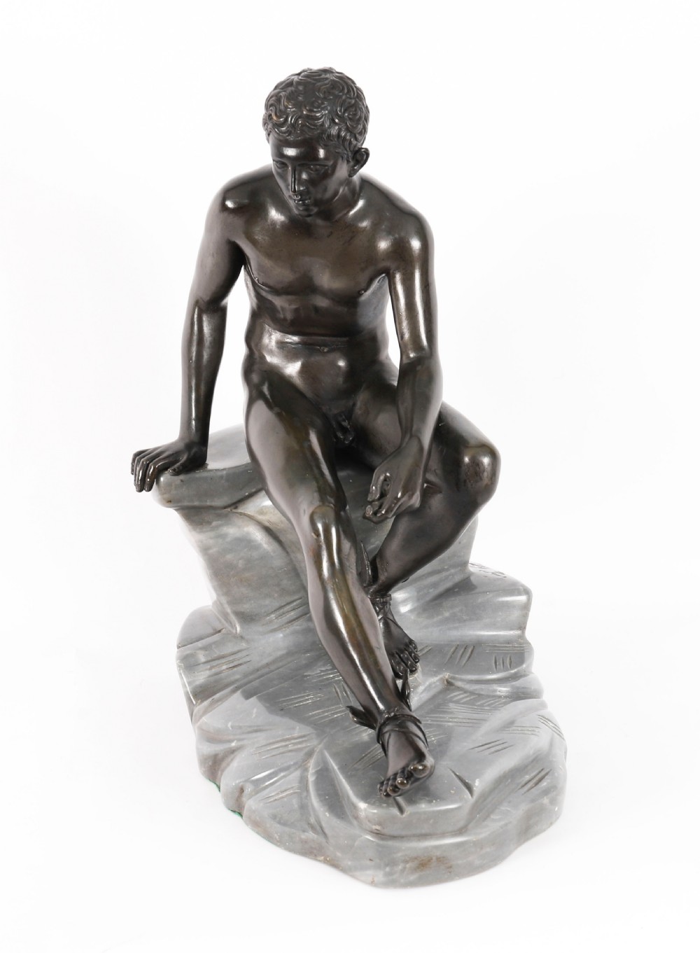 A dark patinated bronze sculpture depicting a nude seated Hermes resting on a carved grey marble base. View XII