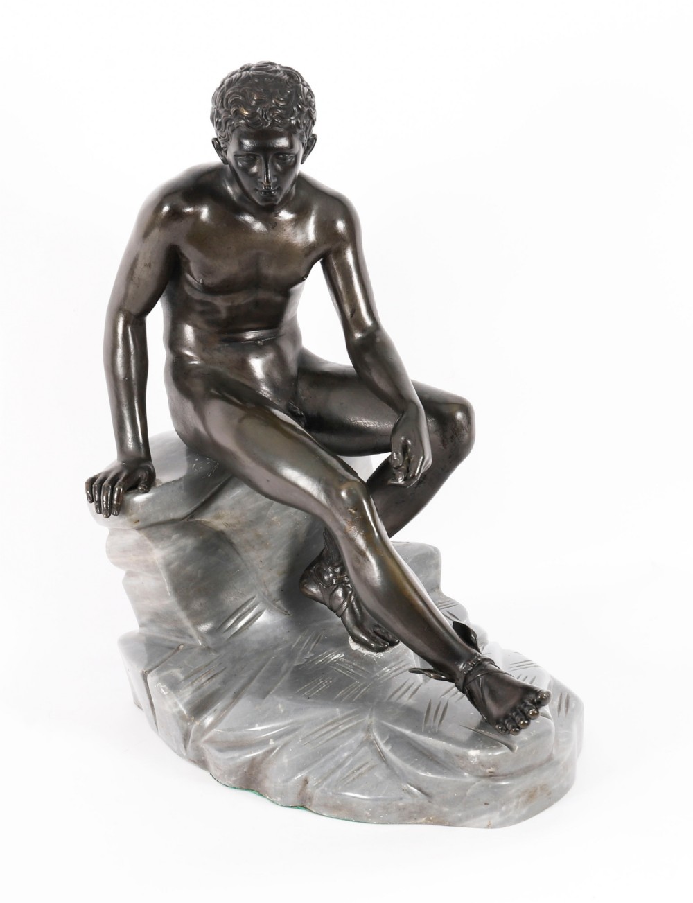 A dark patinated bronze sculpture depicting a nude seated Hermes resting on a carved grey marble base. View XVI