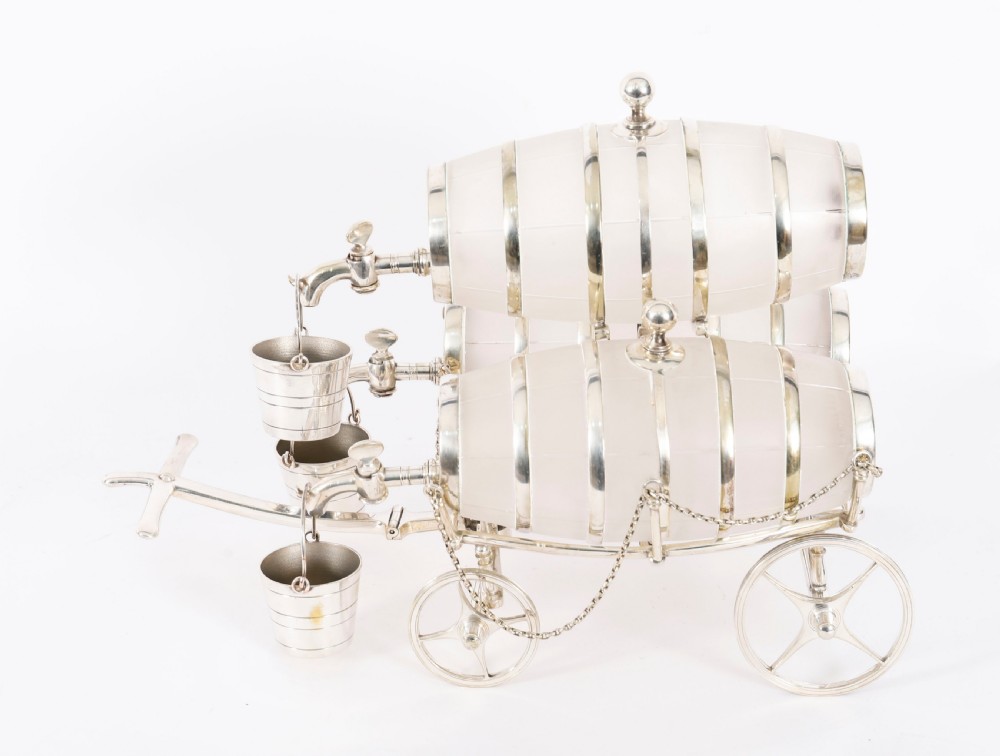 A 19th-century silver-plated carriage frame holding three frosted crystal barrels with taps and hanging miniature bucket tot cups. View XIV