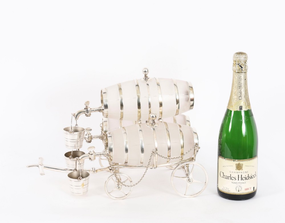 A 19th-century silver-plated carriage frame holding three frosted crystal barrels with taps and hanging miniature bucket tot cups. View XV