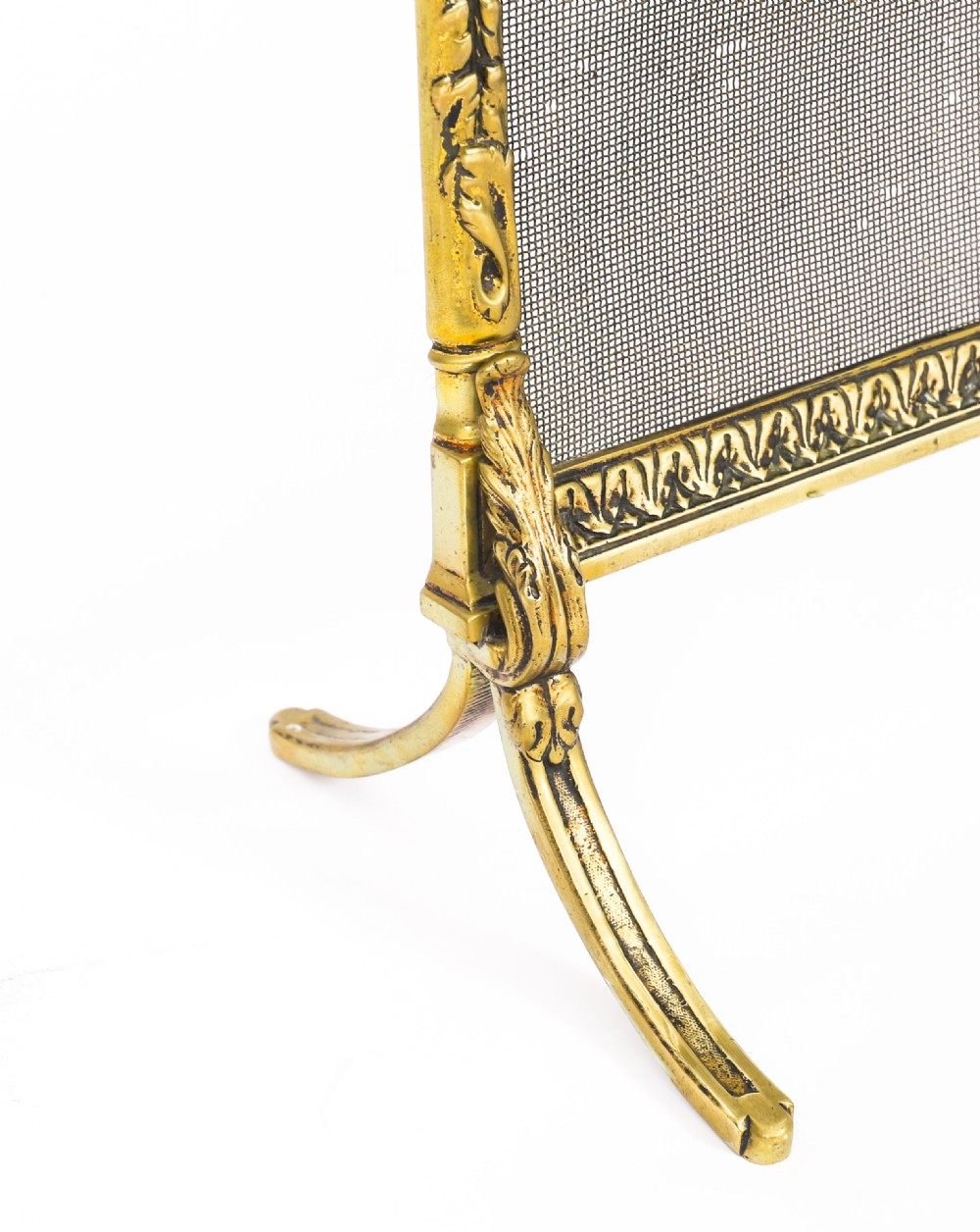 A French Empire Revival gilt bronze fire screen featuring a woven mesh panel, laurel wreath top handle, and central flaming torch motif on splayed feet. View VIII