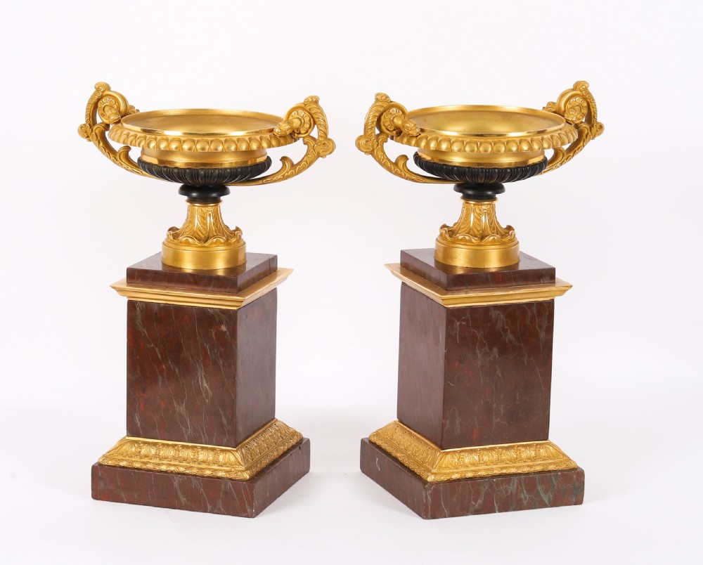 A pair of nineteenth-century French ormolu and bronze tazzas with scroll handles, mounted on tall rectangular red marble plinths. View III