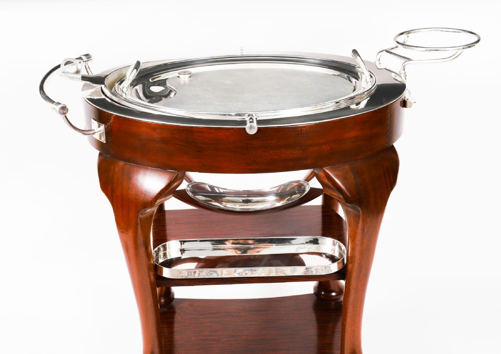 An Art Deco silver-plated beef carving trolley with a hemispherical revolving dome cover mounted on a dark mahogany frame with cabriole legs. View VIII