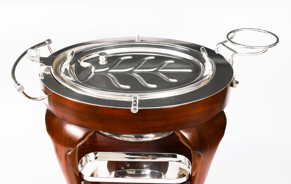 An Art Deco silver-plated beef carving trolley with a hemispherical revolving dome cover mounted on a dark mahogany frame with cabriole legs. View XI