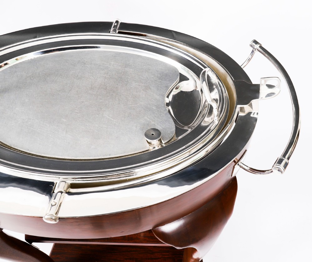 An Art Deco silver-plated beef carving trolley with a hemispherical revolving dome cover mounted on a dark mahogany frame with cabriole legs. View XIII