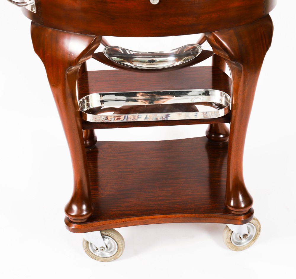 An Art Deco silver-plated beef carving trolley with a hemispherical revolving dome cover mounted on a dark mahogany frame with cabriole legs. View XIV